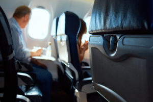 passanger in aircraft cabin. Interior passenger airliner cabin.